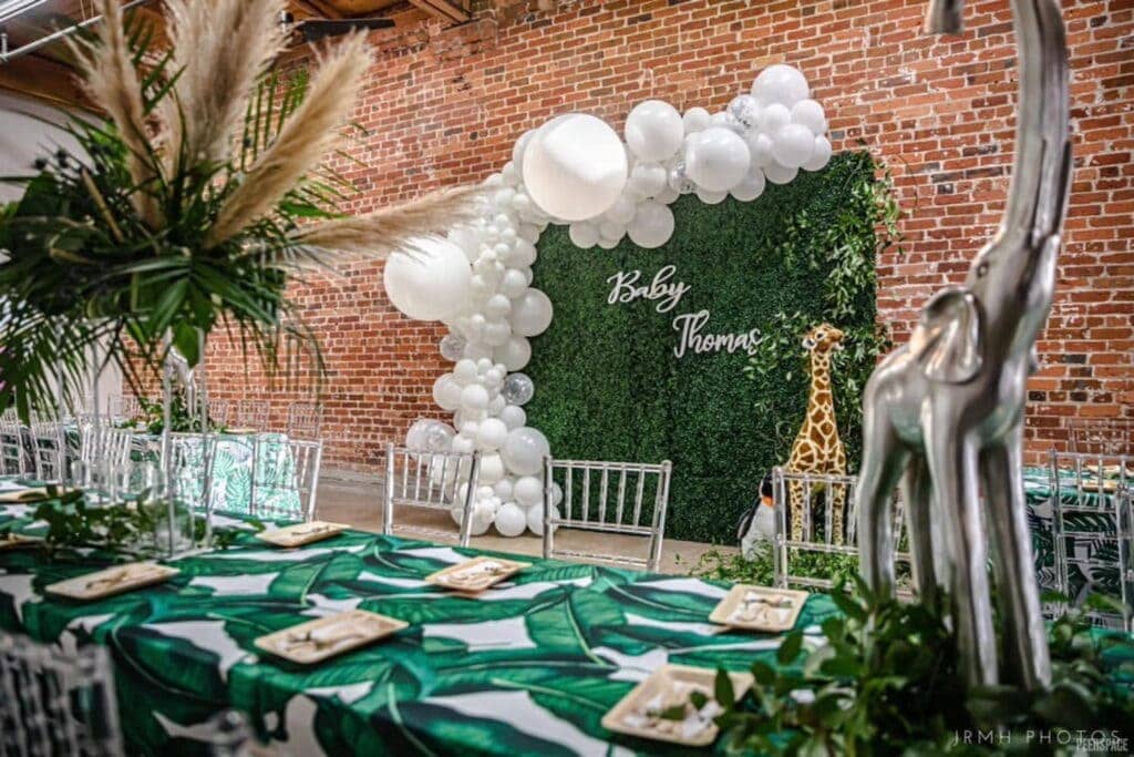An animal-themed baby event with giraffe and elephant decor
