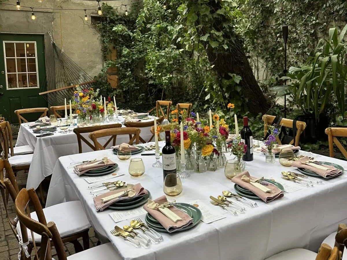 Table settings at small home backyard wedding