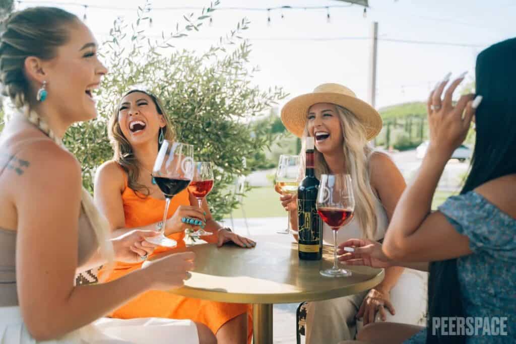 women sipping wine at a winery